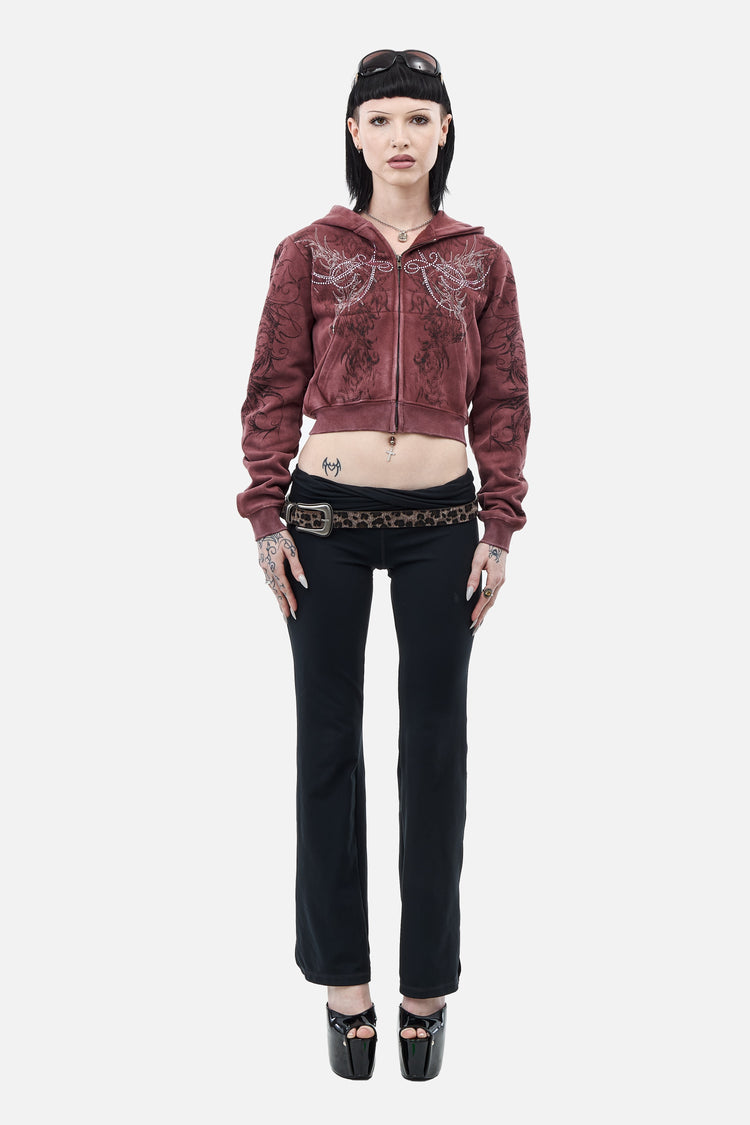Full-length front view of the cropped Fever Hoodie with black flared pants and platforms