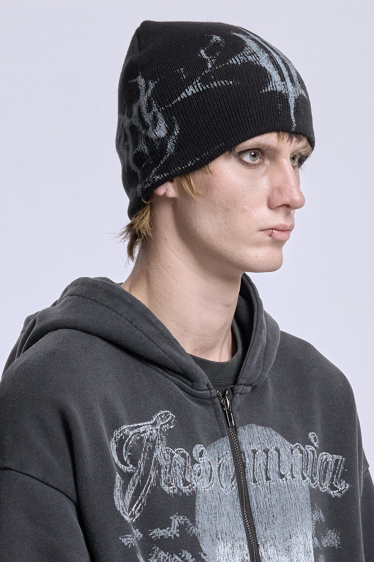 Three-quarter view of the Glitch Logo Beanie worn with a washed black Insomnia zip hoodie