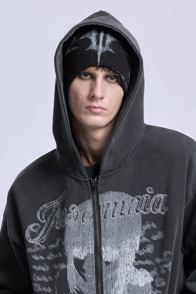 Glitch Logo Beanie worn under a hood with a washed black Insomnia skull zip hoodie