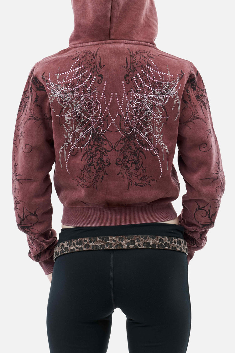 Back of the Fever Hoodie on model, close view of the rhinestone wing design