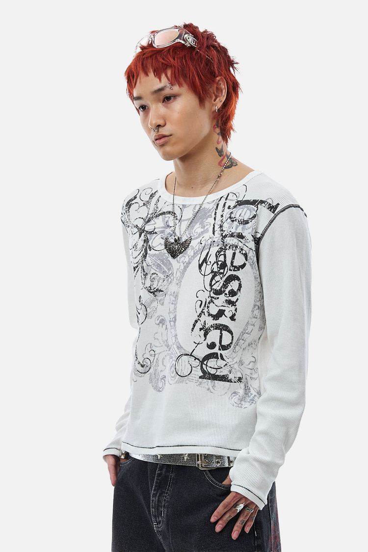 Three-quarter view of the Blessed Thermal Long Sleeve showing the graphic and layered necklaces