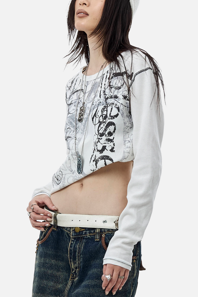 Side view of the cropped Blessed Thermal Long Sleeve showing the Blessed script print
