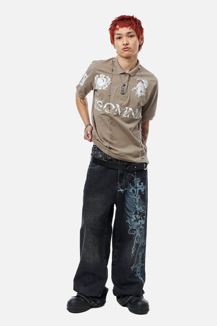 Full-length front view of the Winged Outlaw Denim on a model in a tan polo