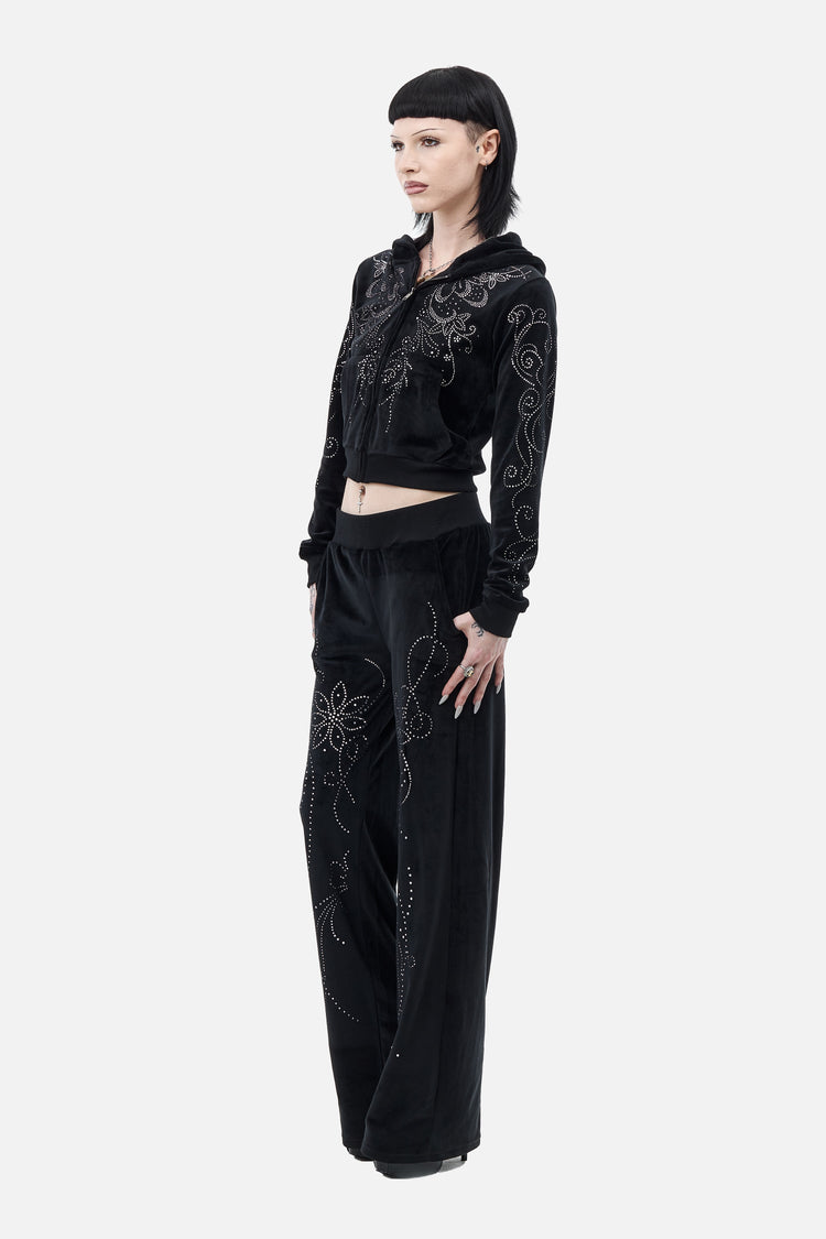 Full-length side view of the Velour Flutter Hoodie and matching wide-leg velour pants