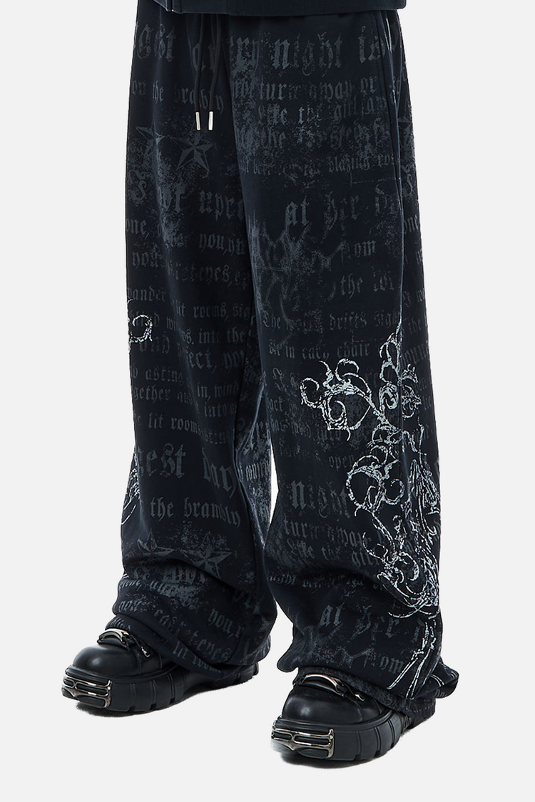Side view of the navy Sacred Sweatpants with gothic text and white floral print