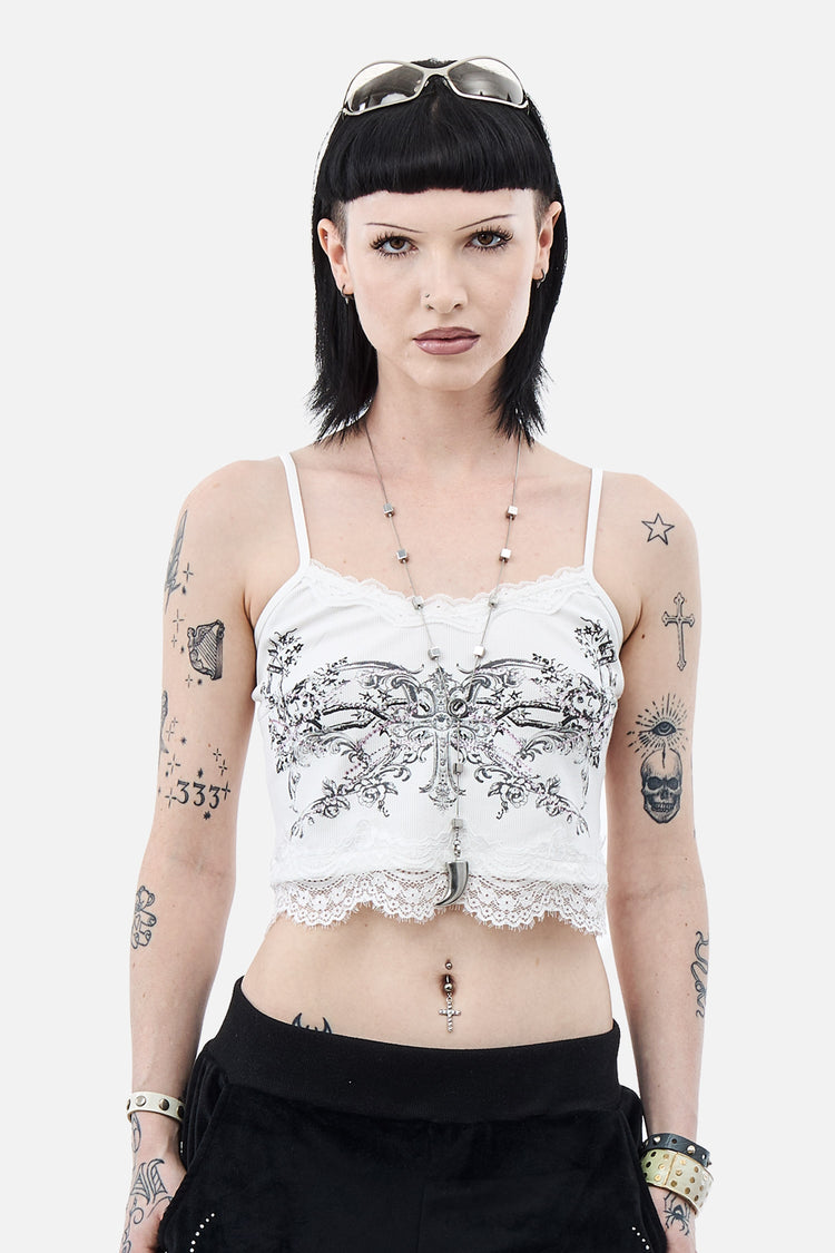 Model wearing the white Blessed Cami Top with grey floral print and lace hem, front view