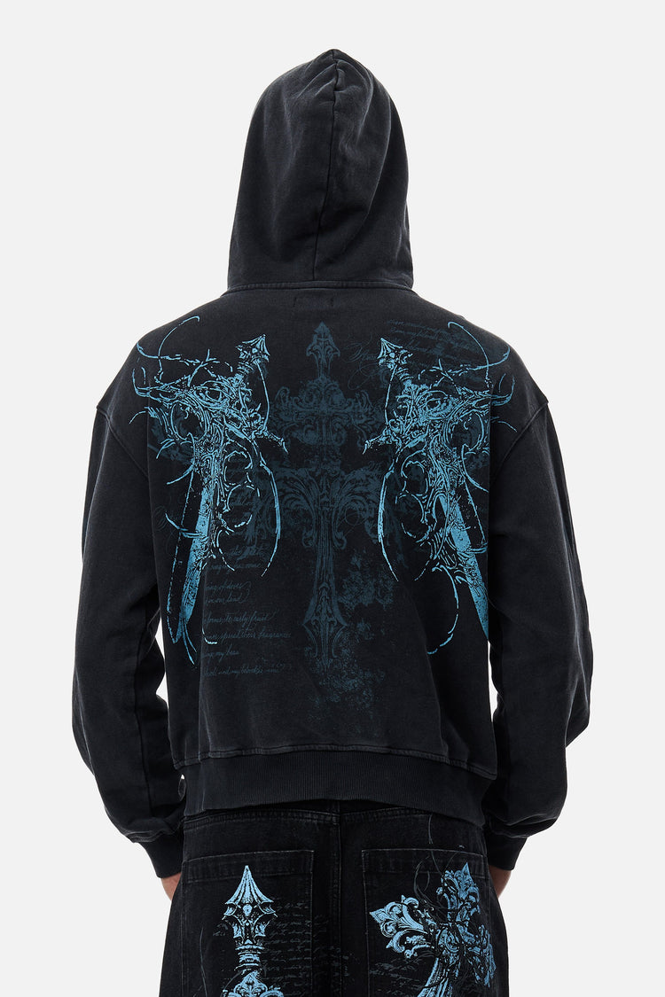Back view of the Blade Hoodie with hood up, showing blue winged cross print