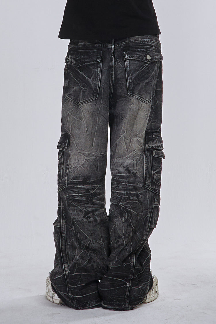 Back view of the Fractured Denim showing the faded wash, flap pockets and stacked legs