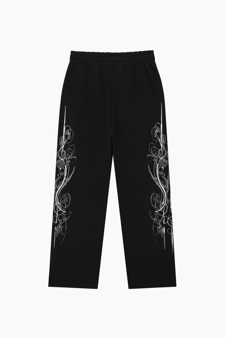 Black Crux Sweatpants laid flat, back view, showing the silver ornate print on each leg