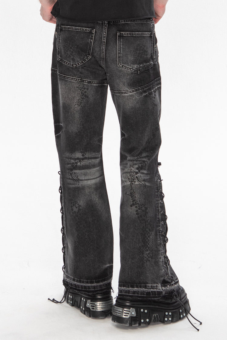 Back close view of the Snakeskin Flared Denim with lace-up sides over platform boots