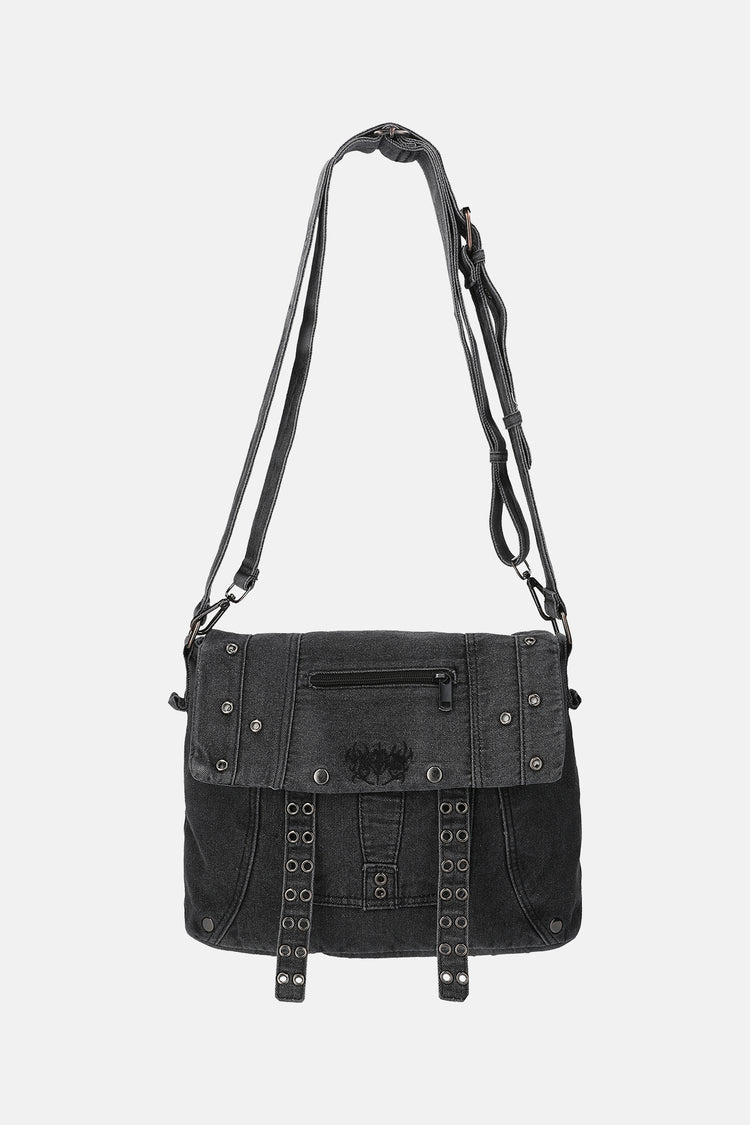 Front of the Washed Denim Bag in faded black, with grommet straps, studs and zip pocket