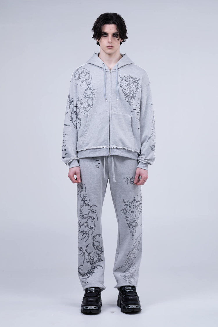 Full-length view of the Gray Sigil Zip Hoodie with matching sweatpants and black sneakers