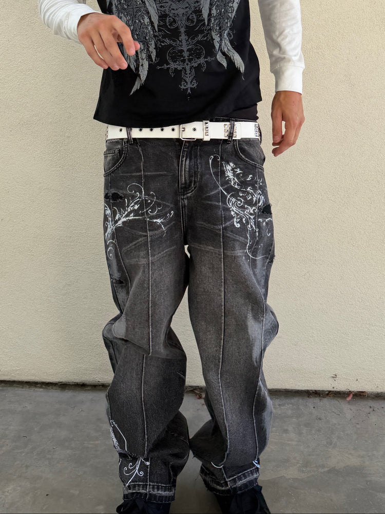 Front close-up of the grey Fleur Destroyer Denim V2 with white floral scroll print