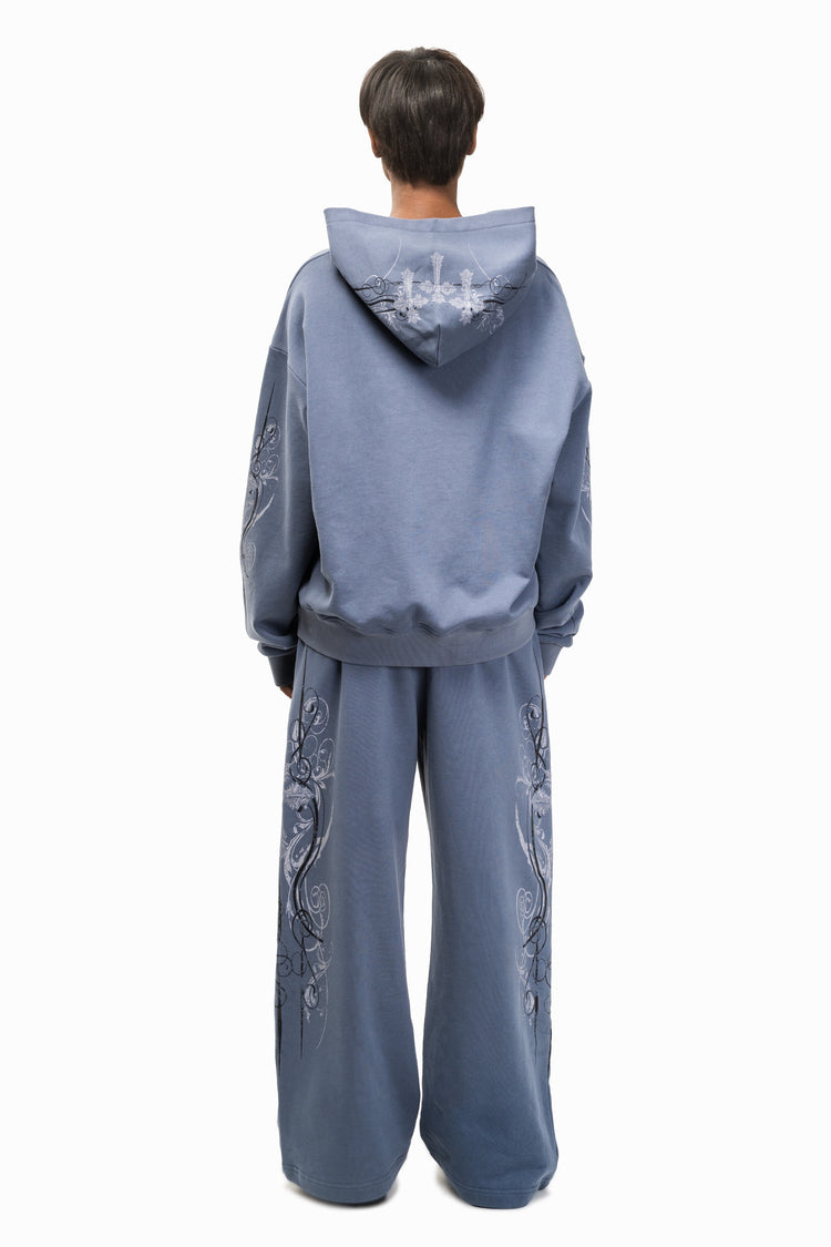Back view of the Midnight Blue Crux Sweatpants with matching hood up behind