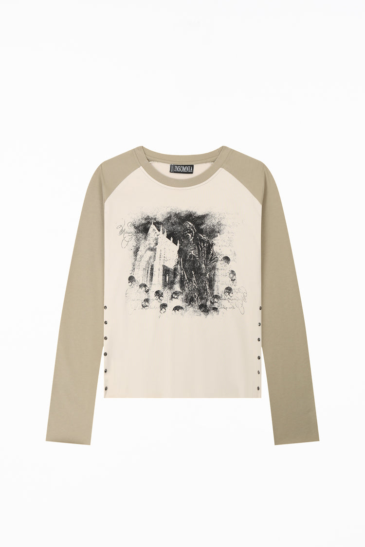 Front of the Reaper Raglan Long Sleeve laid flat, with beige raglan sleeves and stud details