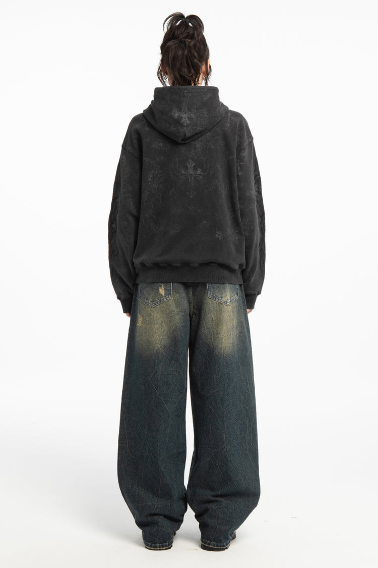 Full-length back view of the Sand Outlaw Denim with a washed black hoodie