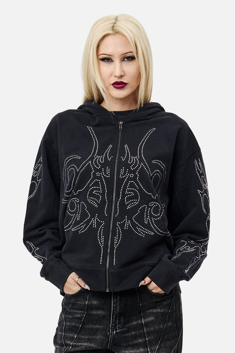 Model wearing the black Sigil Rhinestone Zip Hoodie with rhinestone sigil design, front view