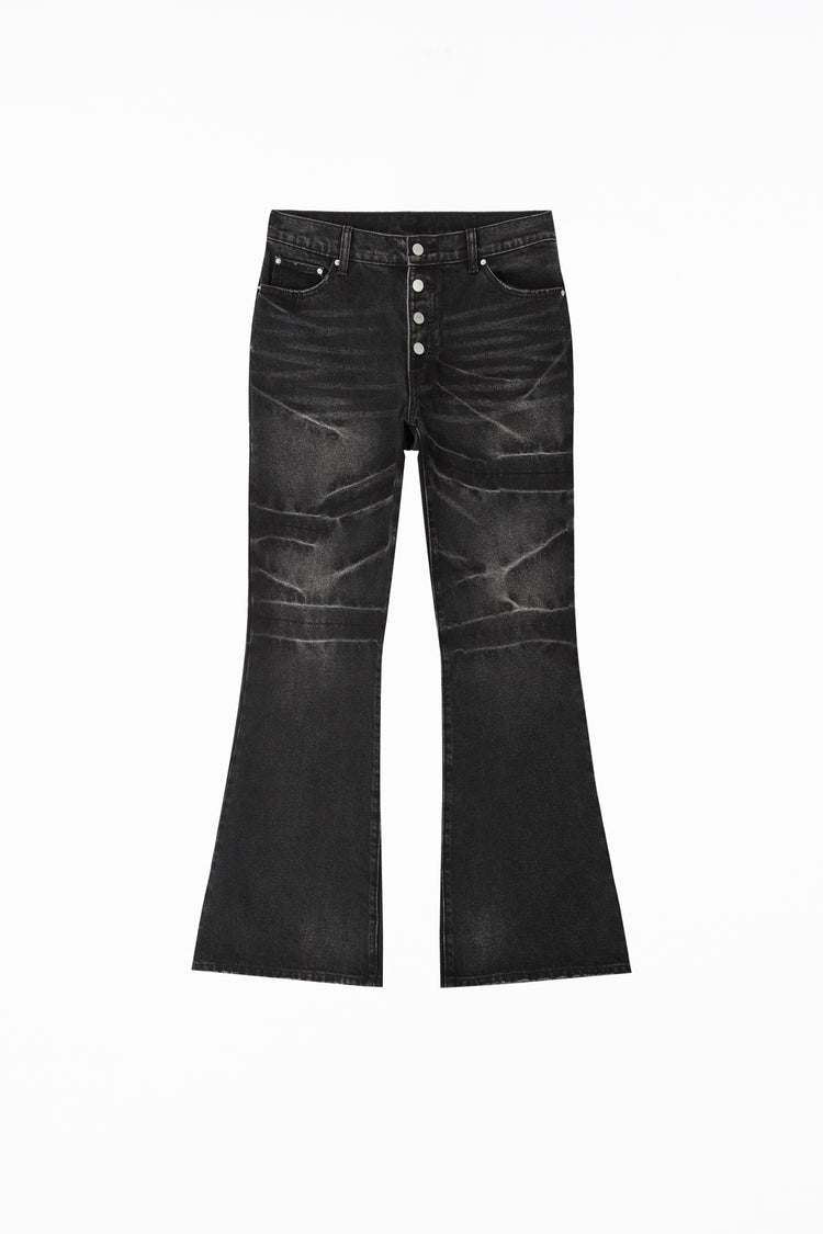 Whiskered Black Rogue Denim laid flat, front view with button fly and flared hems