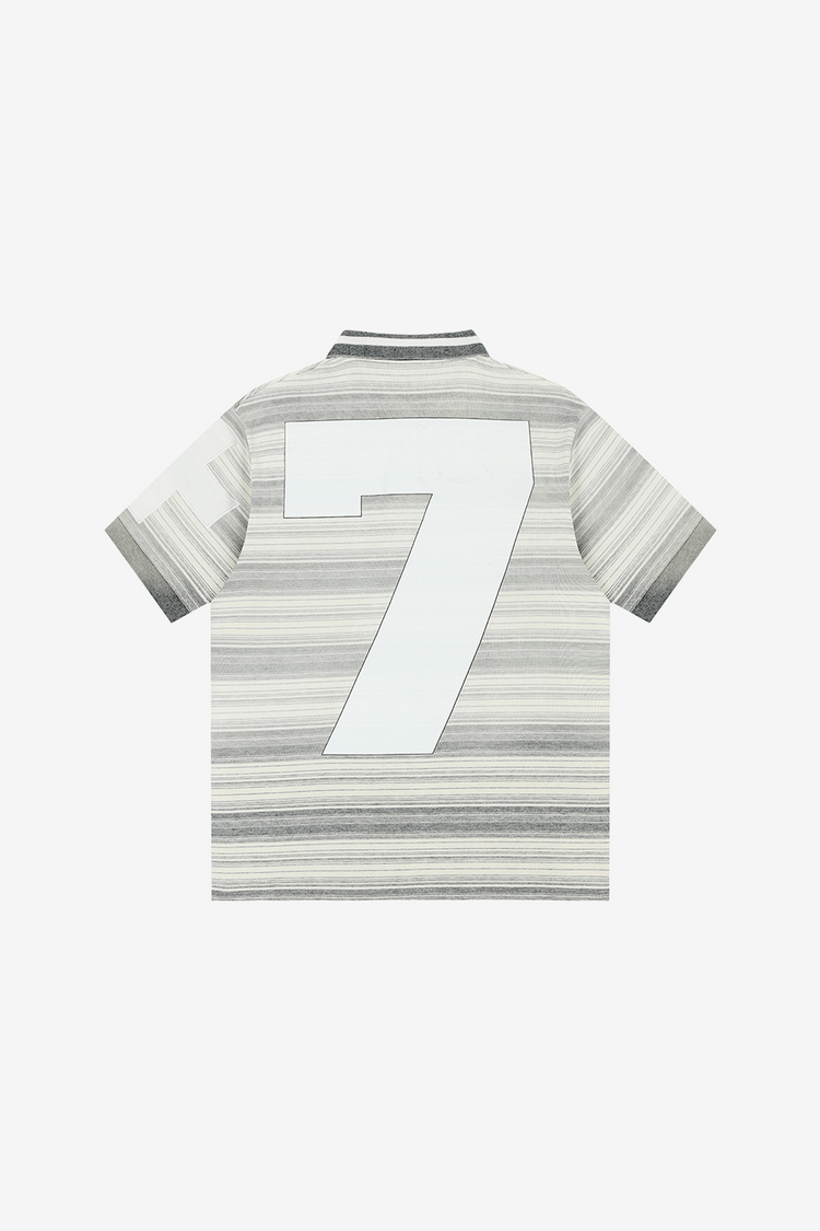 Back of the Striped Crest Polo laid flat, with large white number 7 across the stripes