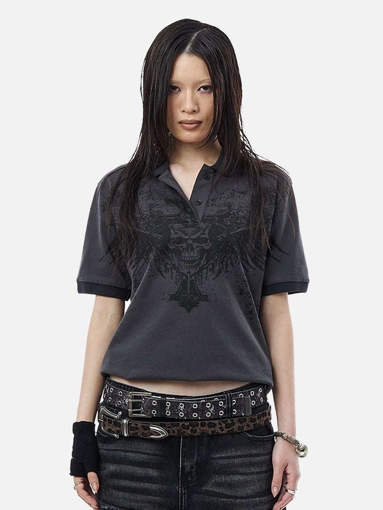 Model wearing the Banished Polo with winged skull graphic and studded belts, front view