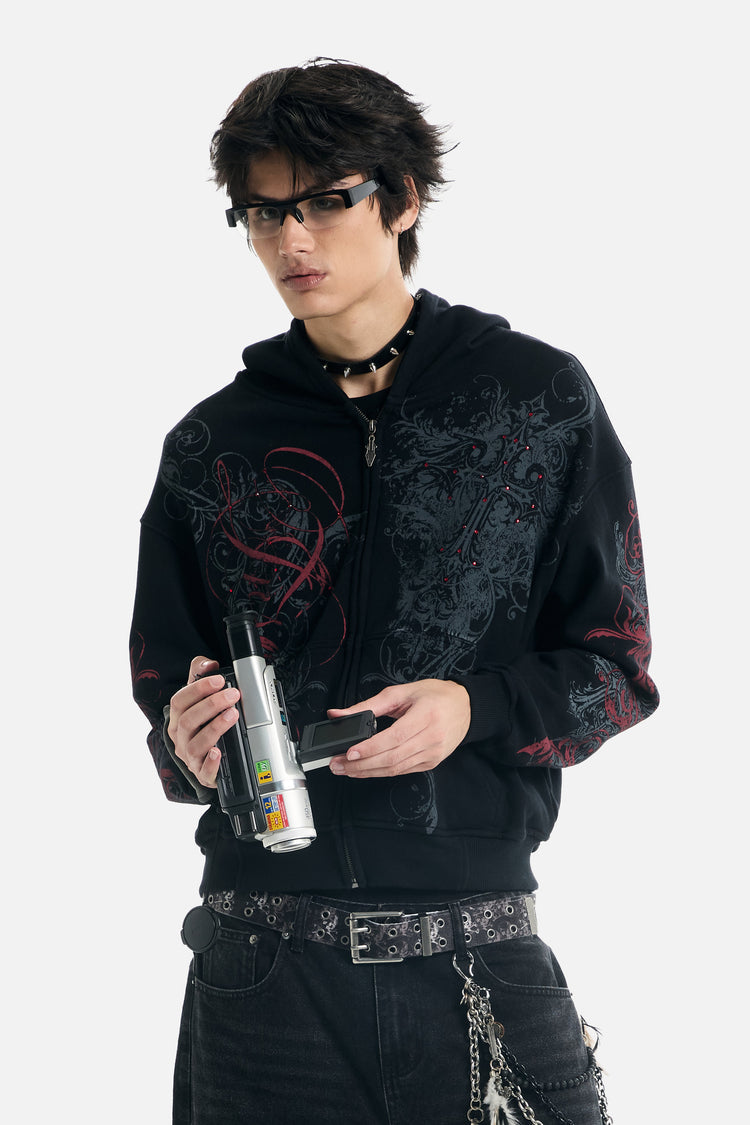 Model in sunglasses holding a camcorder while wearing the Black Scripture Eclipse Zip Up Hoodie