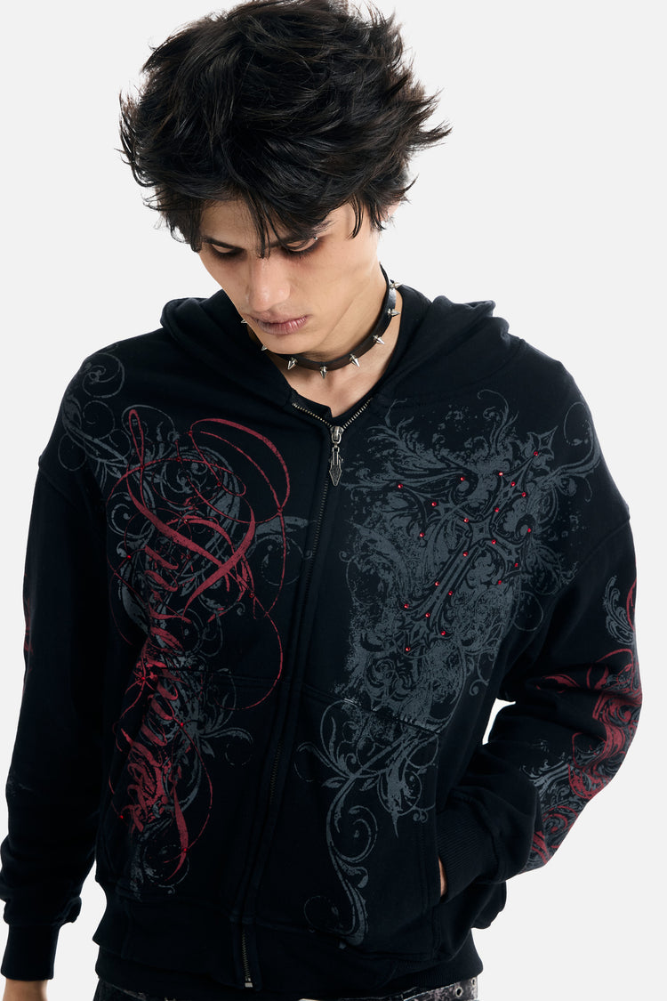 Model in the Black Scripture Eclipse Zip Up Hoodie, close front view of the red and grey filigree