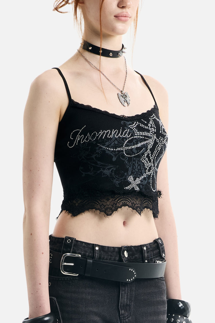 Close angled view of the Blessed Rhinestone Lace Crop Tank showing rhinestone script and lace hem