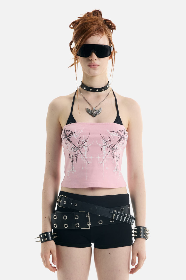 Model wearing the pink Dagger Tube Top with studded choker and belted black shorts