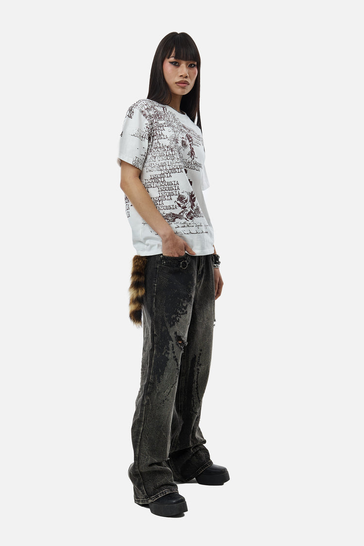 Three-quarter view of the distressed Splatter Outlaw Denim with platform boots