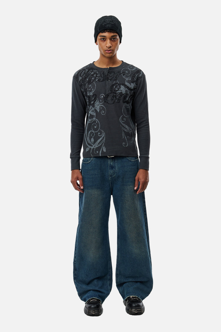 Model wearing the Washed Blue Outlaw Denim and black beanie, full-length front view
