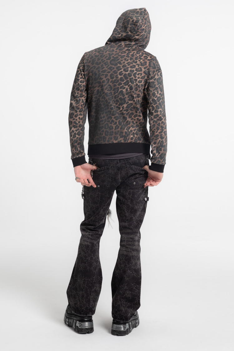 Back view of the leopard FAME Slim Zip Hoodie worn with hood up and flared jeans