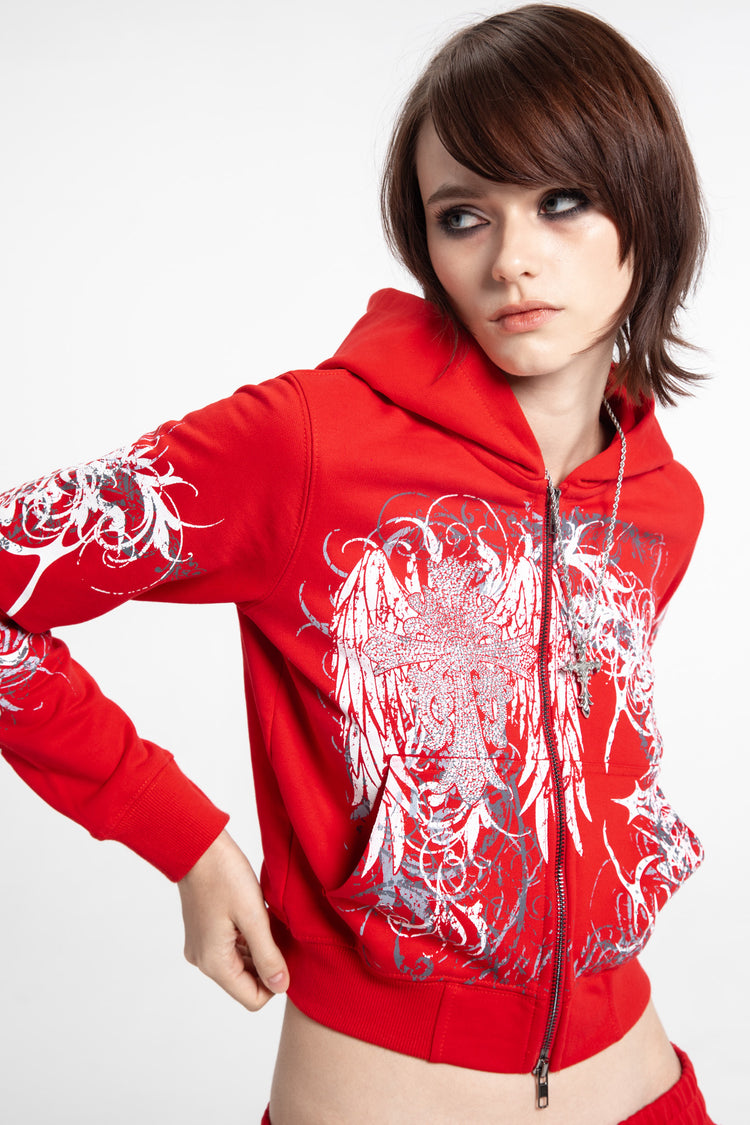 Model in the Red Eclipse Cropped Hoodie with hand on hip, close-up front
