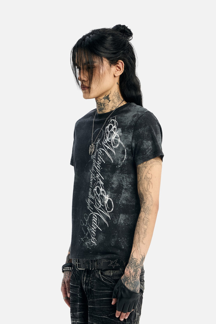 Side profile close-up of the washed black Midnight Tee on a tattooed model