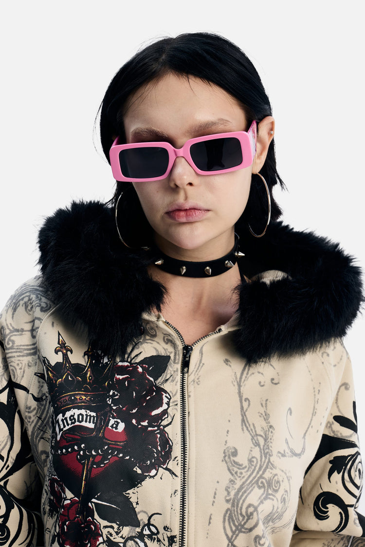Model wearing the pink Note Glasses with a fur-trimmed hoodie, front view