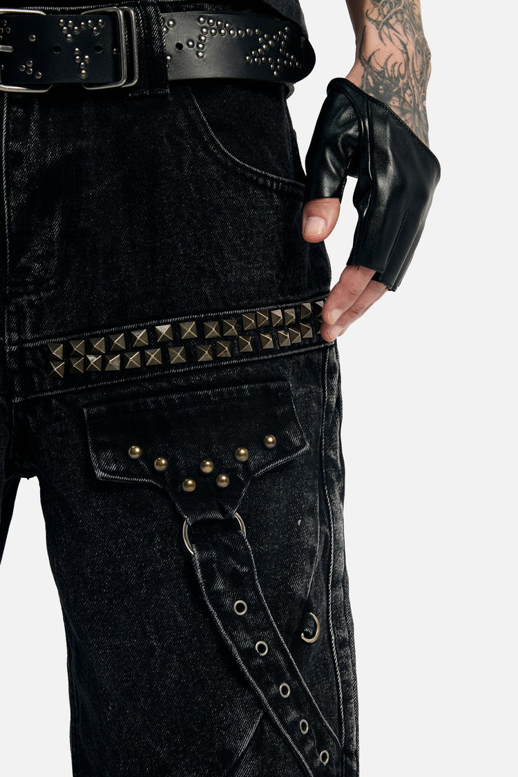 Close-up of the Studded Rogue Denim's pyramid stud band and studded cargo strap