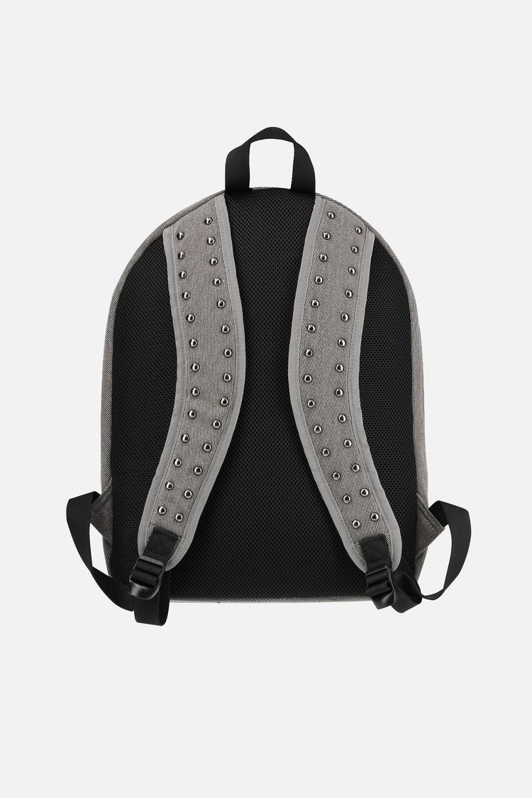 Back of the Studded Flag Backpack showing studded shoulder straps and black panel