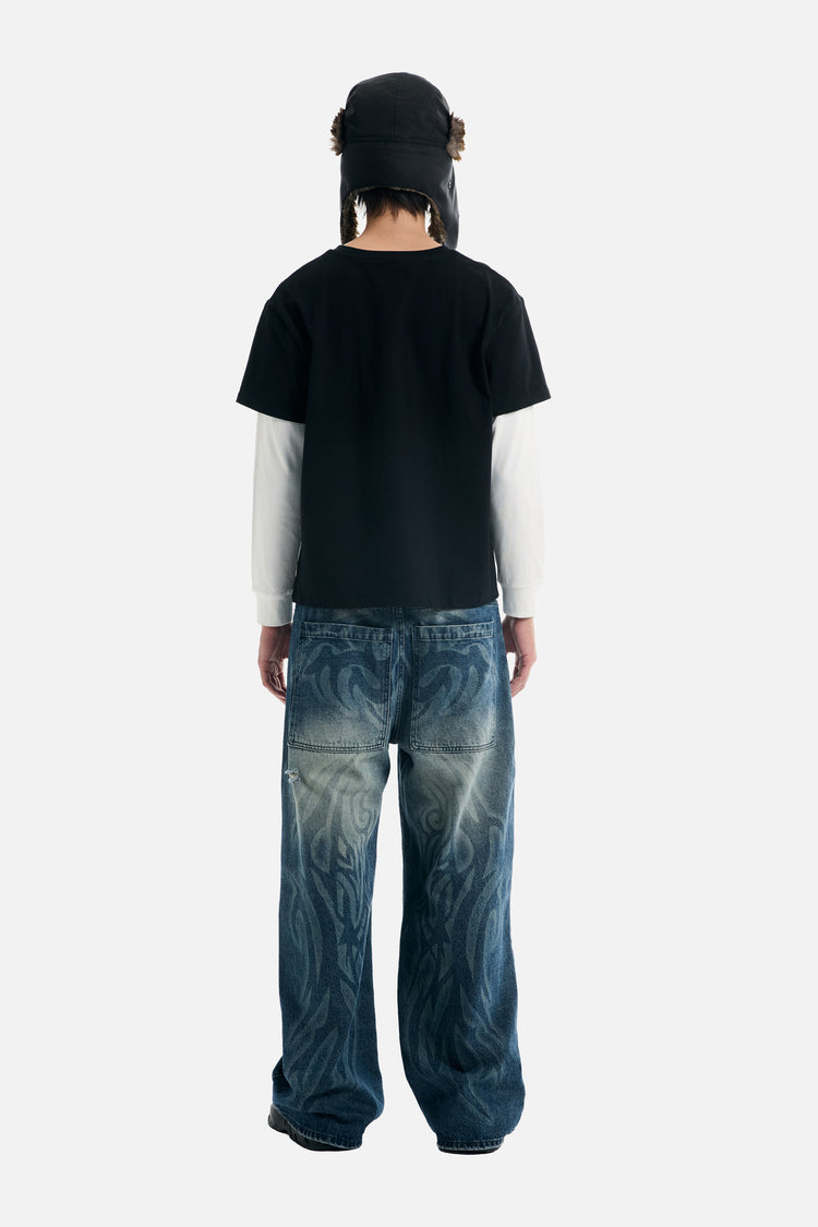 Full-length back view of the Tribal Outlaw Denim with a layered black tee