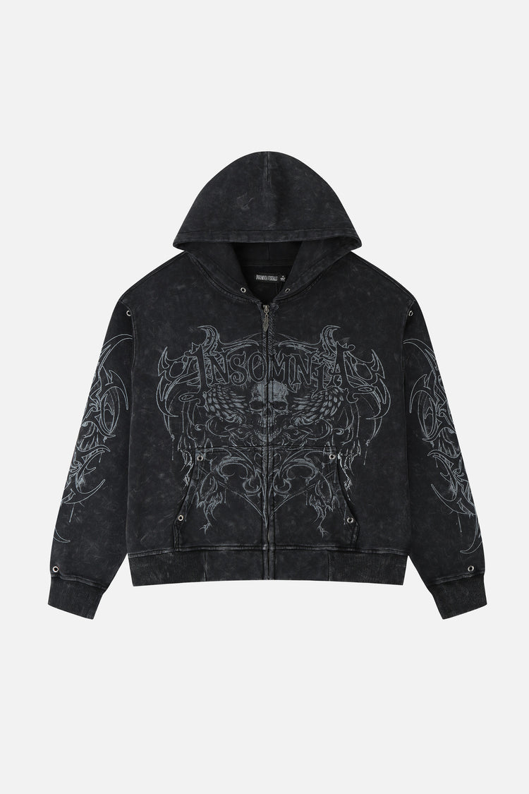 Front of the washed black Tribal Zip Up Hoodie laid flat, with grey tribal skull graphic