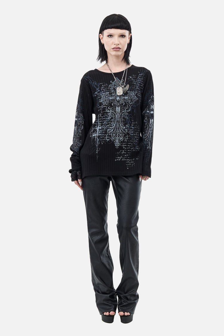 Full-length front view of the Scripture Ribbed Long Sleeve with black leather pants and heels