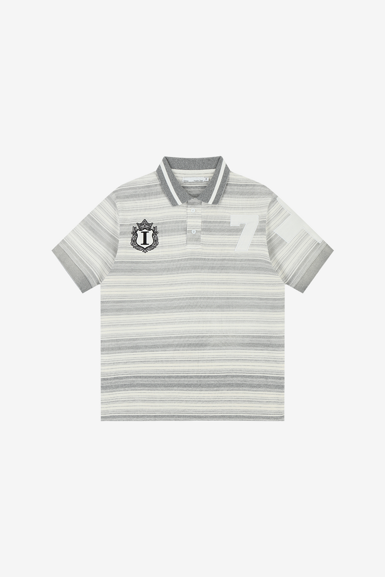 Front of the grey Striped Crest Polo laid flat, with crest patch and tonal number 7
