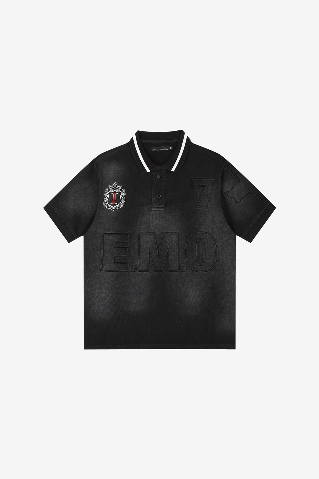 Front of the faded black E.M.O Polo laid flat, with striped collar and crest patch