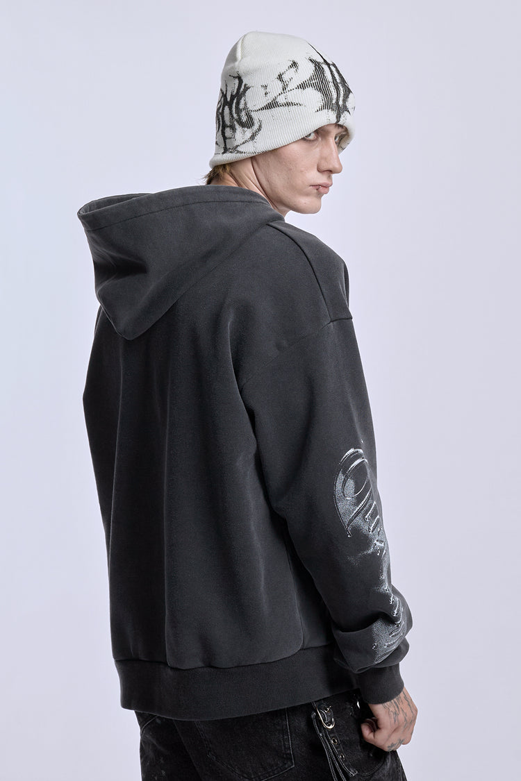 Over-the-shoulder view of the White Glitch Logo Beanie with a charcoal hoodie