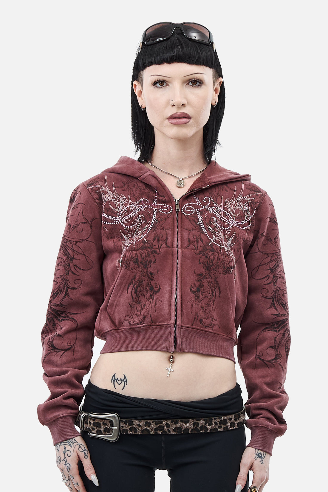 Model wearing the washed burgundy Fever Hoodie cropped with rhinestone wing details, front view