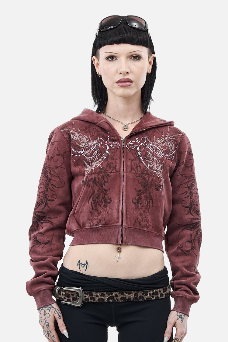 Model wearing the washed burgundy Fever Hoodie cropped with rhinestone wing details, front view