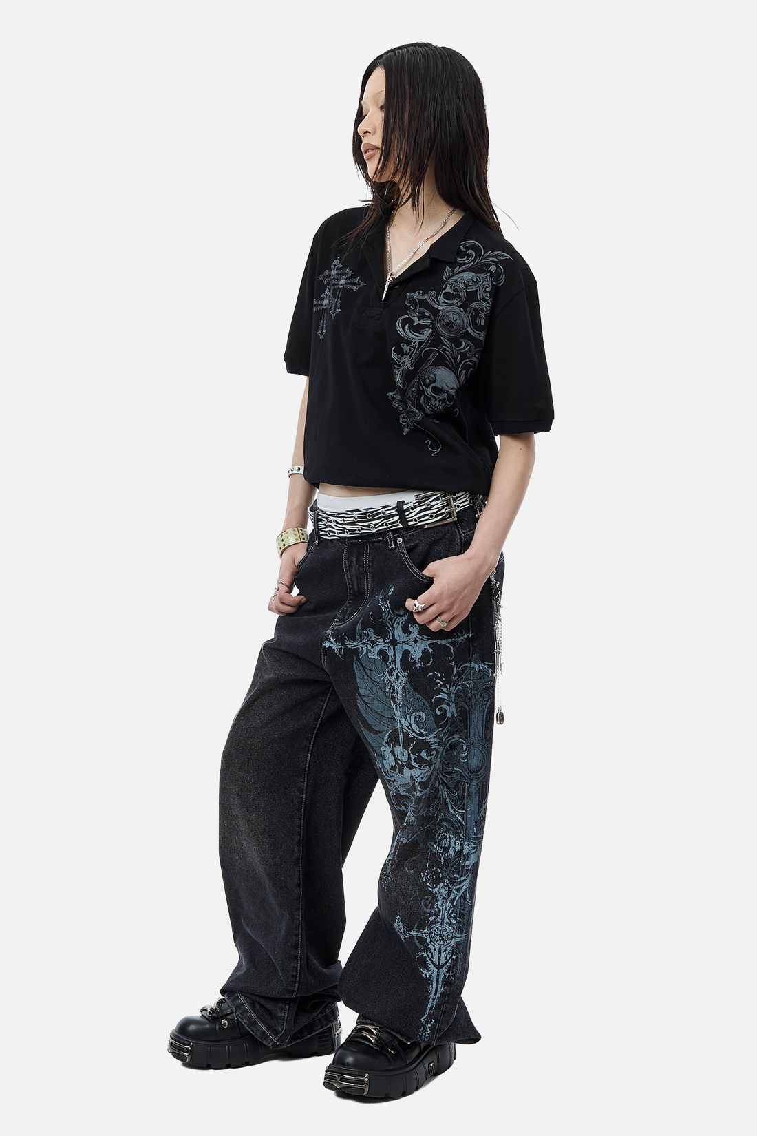 Three-quarter view of the Winged Outlaw Denim with zebra belt and black platforms