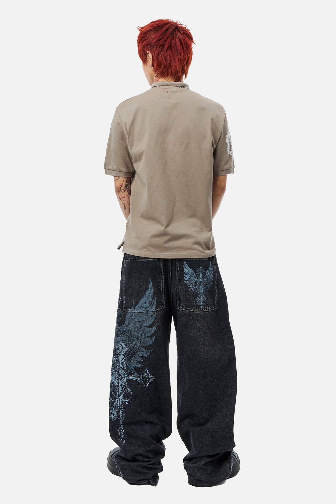 Full-length back view of the Winged Outlaw Denim showing the wing print