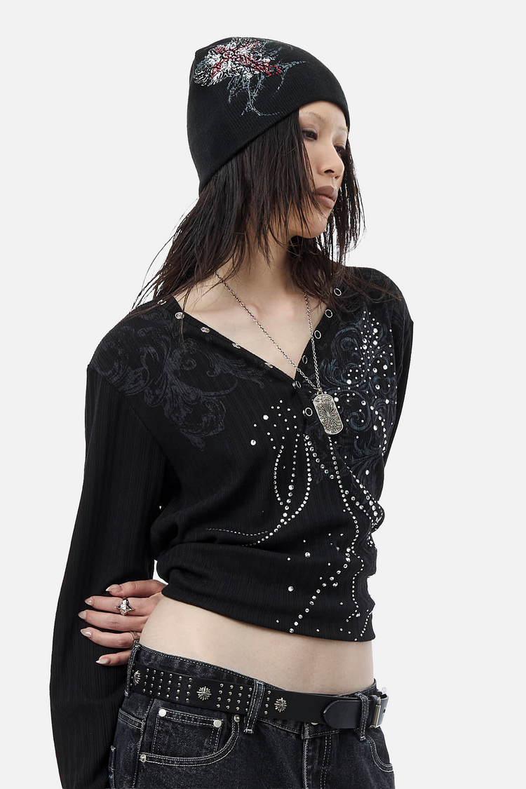 Three-quarter view of the Fate Ribbed Long Sleeve showing rhinestone studs on a model
