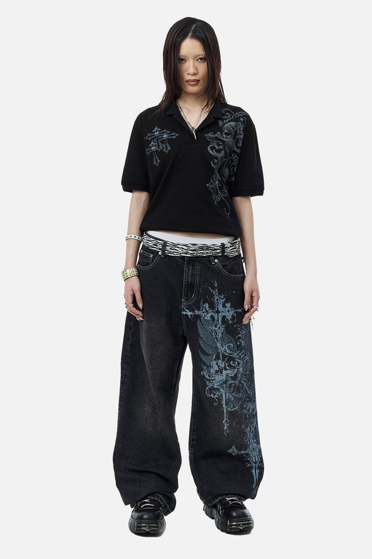 Model wearing the Winged Outlaw Denim with a cropped black polo, full-length front view
