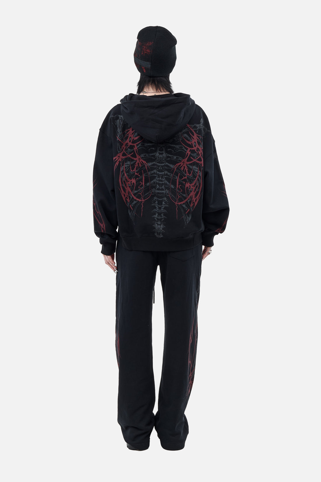 Back view of the Skeleton Sweatpants with matching ribcage print hoodie, full-length
