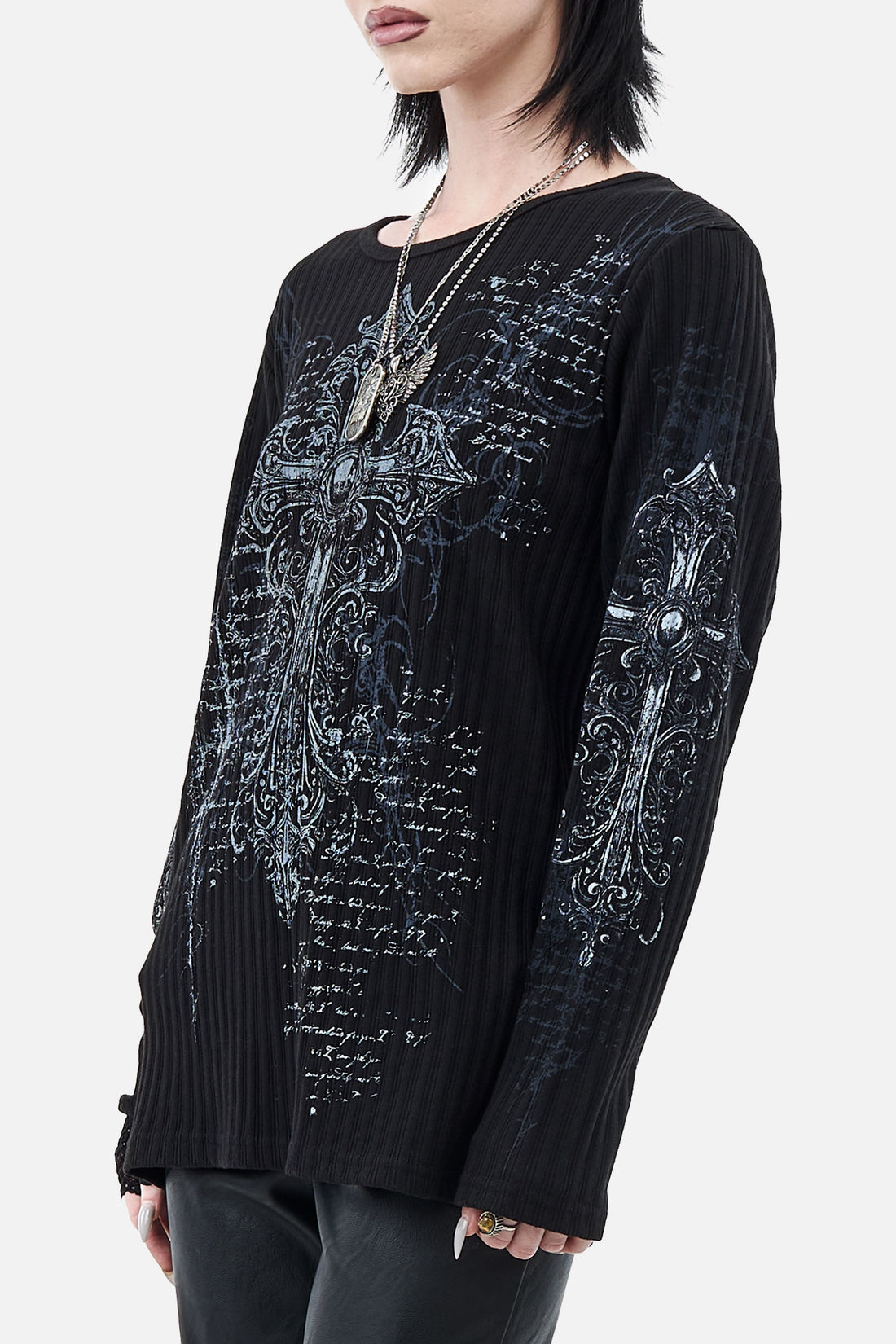 Side angle of the Scripture Ribbed Long Sleeve showing the cross print on the sleeve